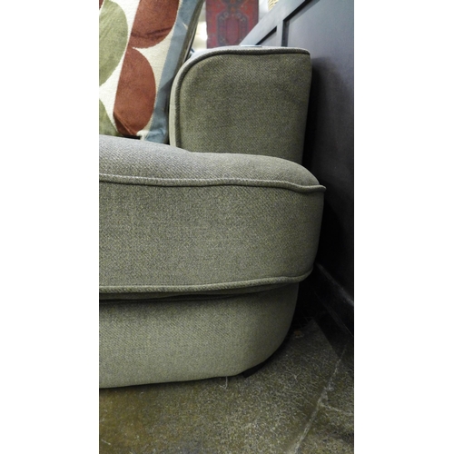 1449 - A khaki upholstered three seater sofa