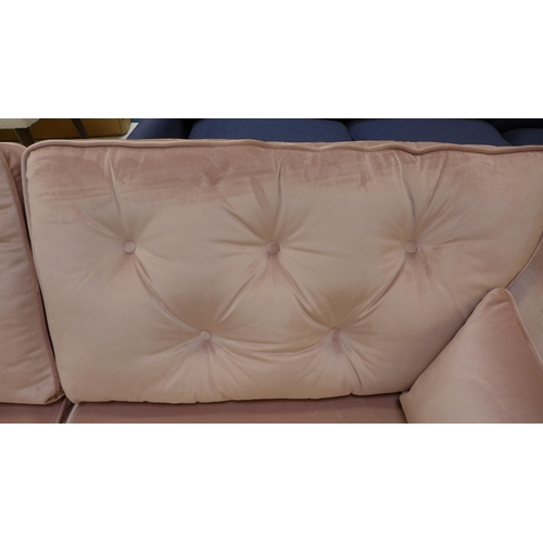 1454 - A pink velvet three seater sofa