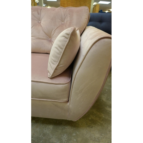 1454 - A pink velvet three seater sofa