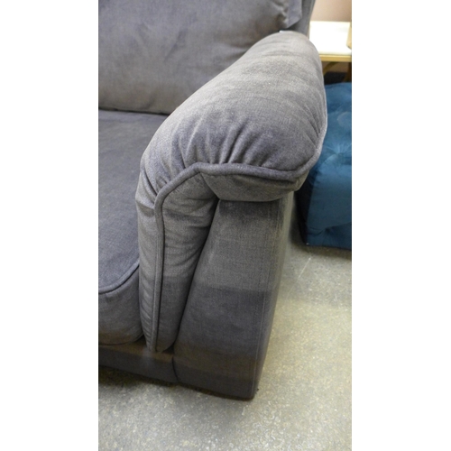 1476 - A grey velvet four seater sofa