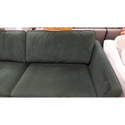 1511 - A green velvet four seater sofa