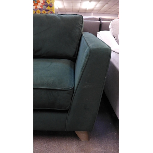 1511 - A green velvet four seater sofa