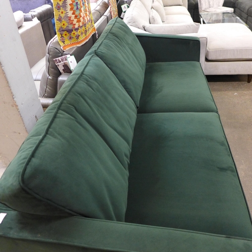 1511 - A green velvet four seater sofa