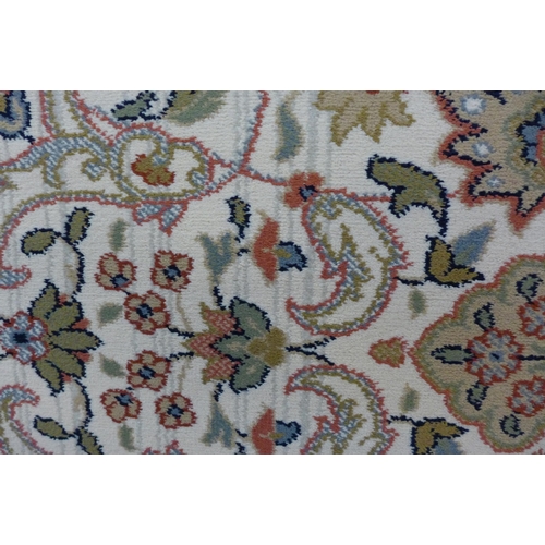 1549 - A cream ground full pile floral patterned rug 300 x 200