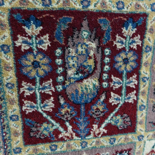 1552 - A blue fine woven ground rug with traditional Persian panel design