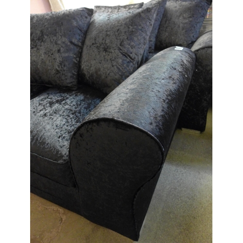 1553 - A black velvet three seater sofa and two seater sofa