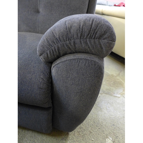 1555 - A blue upholstered reclining two seater sofa and reclining love seat