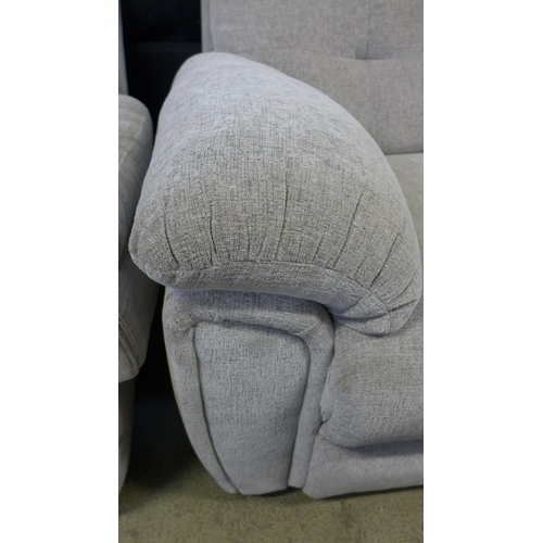 1601 - A grey upholstered two seater sofa