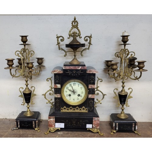 336 - A 19th Century French Belge noir clock garniture, the movement signed Japy Freres