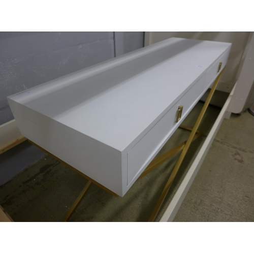 1643 - A white two drawer console with gold legs