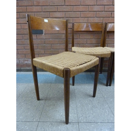 14 - A set of four Danish Frem Rojle teak and paper cord seated dining chairs, designed by Poul M. Volthe... 