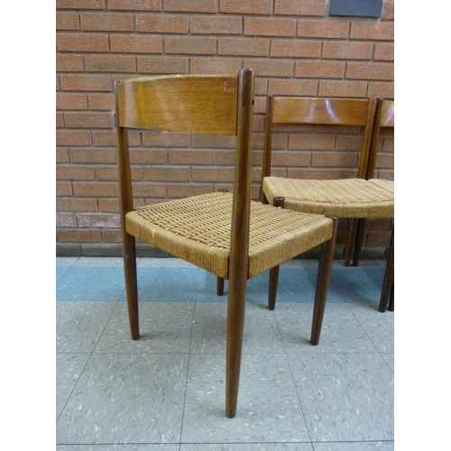 14 - A set of four Danish Frem Rojle teak and paper cord seated dining chairs, designed by Poul M. Volthe... 