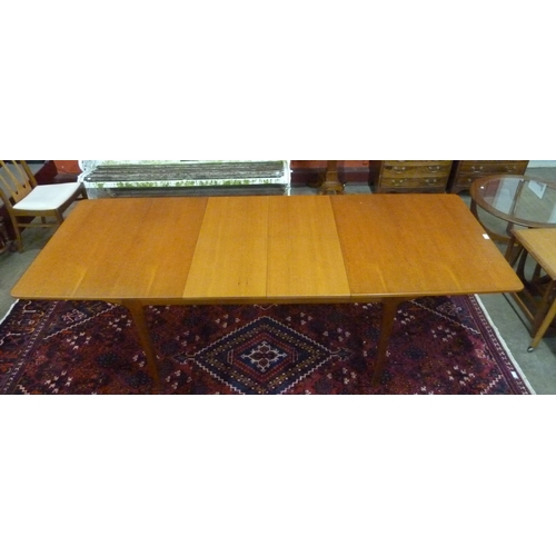 15 - A McIntosh teak extending T3 dining table