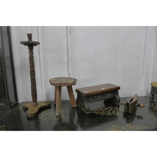 198 - A 17th Century Gothic style carved oak stool, an elm primitive stool, fruitwood clamp and a carved w... 