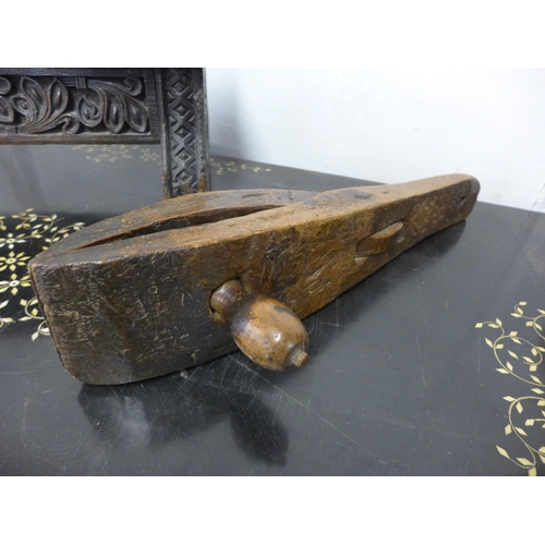 198 - A 17th Century Gothic style carved oak stool, an elm primitive stool, fruitwood clamp and a carved w... 