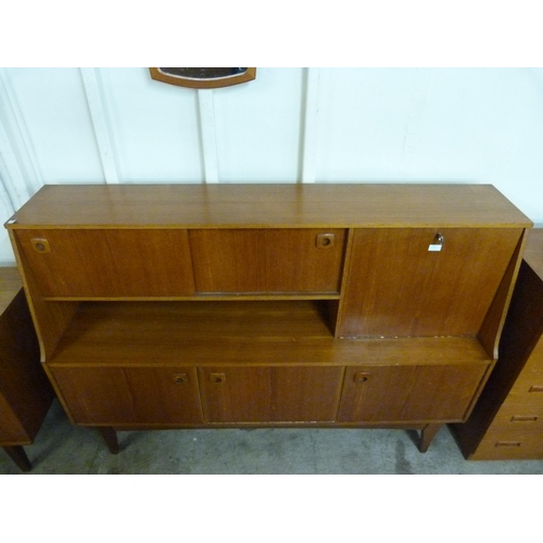 22 - A teak highboard