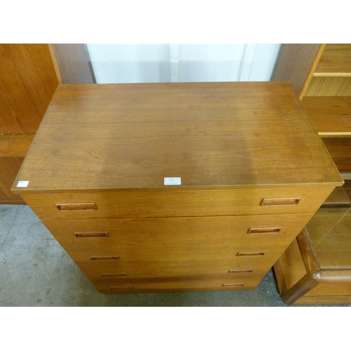 23 - A teak chest of drawers