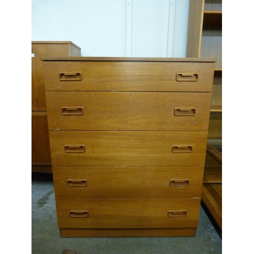 23 - A teak chest of drawers