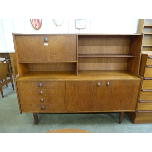 28 - A teak highboard