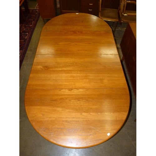 36 - A Danish Dyrlund teak extending dining table