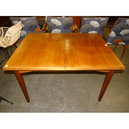 40 - A teak extending dining table