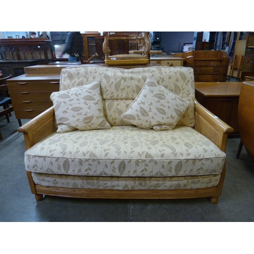 47 - An Ercol Blonde ash settee