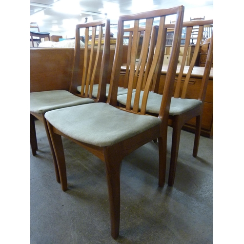 48 - A teak drop-leaf table and four chairs