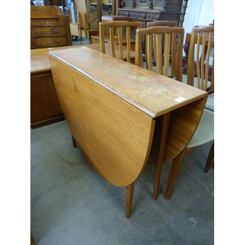 48 - A teak drop-leaf table and four chairs