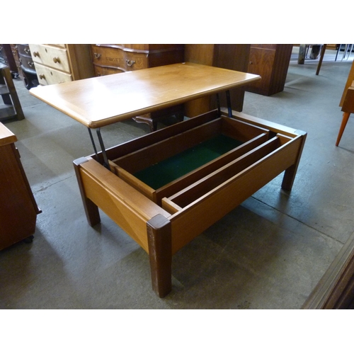 50 - A teak metamorphic coffee table and a stool