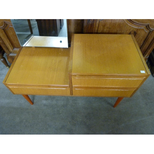 51 - A small teak dressing table