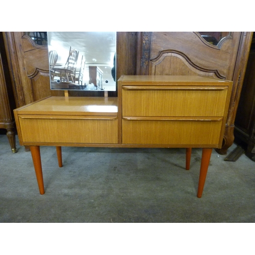 51 - A small teak dressing table