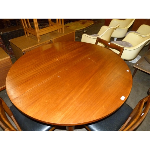 57 - A teak extending dining table and five chairs