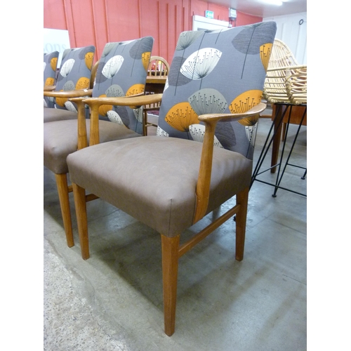 63 - A set of four teak dining chairs