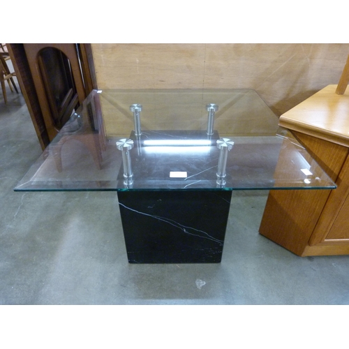 65 - A Italian style black marble and glass topped coffee table