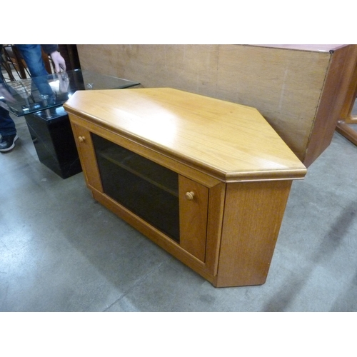 66 - Two teak bookcases, a teak TV stand and a nest of two tables