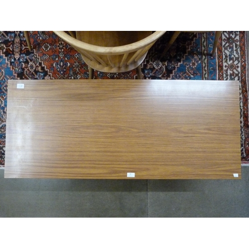 70 - A teak coffee table