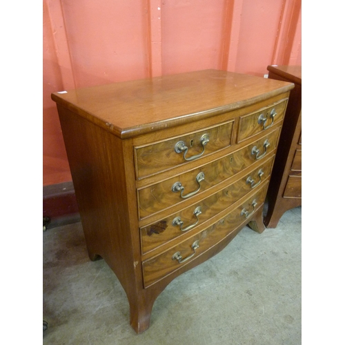 71 - A pair of George III style mahogany bow front bachelors chests of drawers