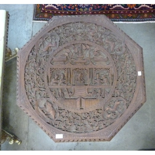 78 - A Burmese carved wood octagonal centre table