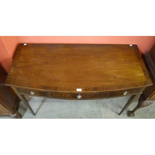 81 - An Edward VII mahogany bow front three drawer serving table