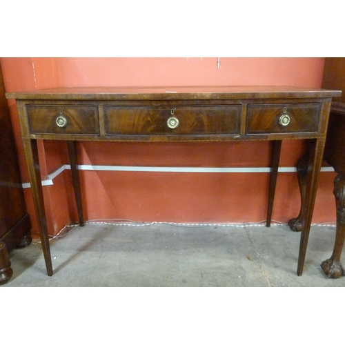 81 - An Edward VII mahogany bow front three drawer serving table