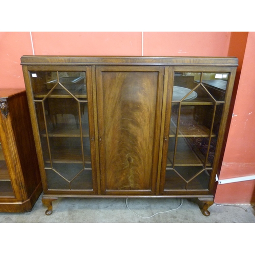 83 - An Edward VII mahogany three door bookcase