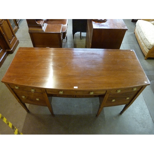 86 - A Regency inlaid mahogany bow front sideboard