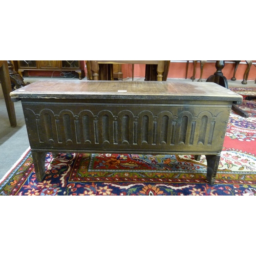 93 - A 17th Century style carved oak six plank coffer