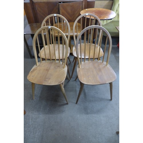 53 - An Ercol Blonde elm and beech drop-leaf table and four Windsor chairs