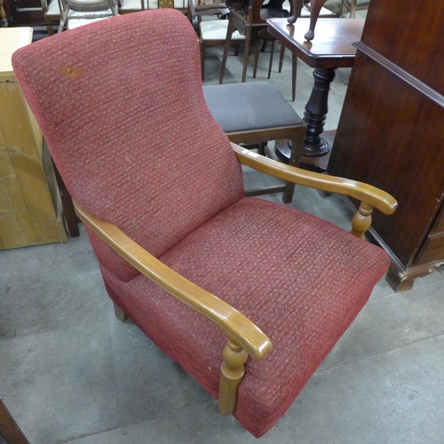 216 - A Victorian style walnut and red fabric upholstered open armchair