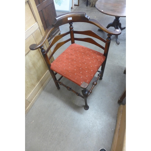 261 - A George III style carved mahogany corner chair