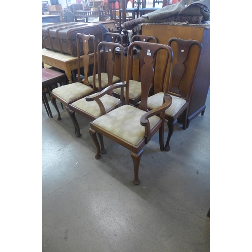 263 - A set of six Queen Anne style walnut dining chairs