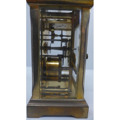 622 - A gilt brass and four glass sided carriage clock with long service inscription plaque to the front