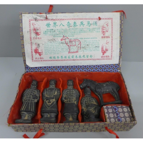 639 - A boxed set of terracotta oriental figures