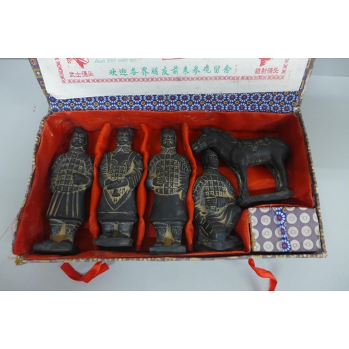 639 - A boxed set of terracotta oriental figures